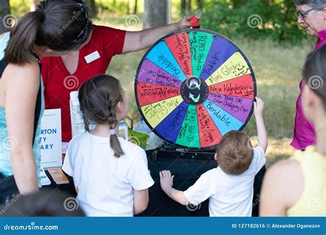 Child Spinning the Wheel Raffle in the Park Editorial Photo - Image of girl, childhood: 127182616