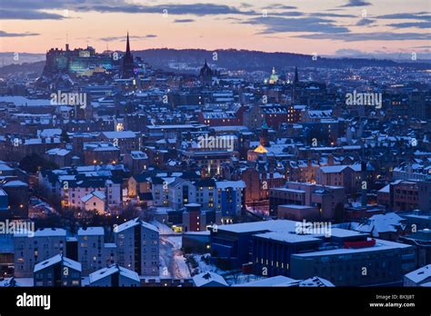 Snowy Edinburgh and the Castle at dusk from Salisbury Crags Stock Photo ...