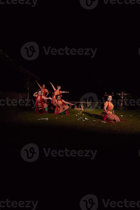 Portrait of Balinese dancer while dancing on the stage with traditional ...