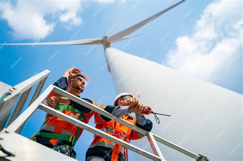 Premium Photo | Wind turbine maintenance engineer at wind farm ...