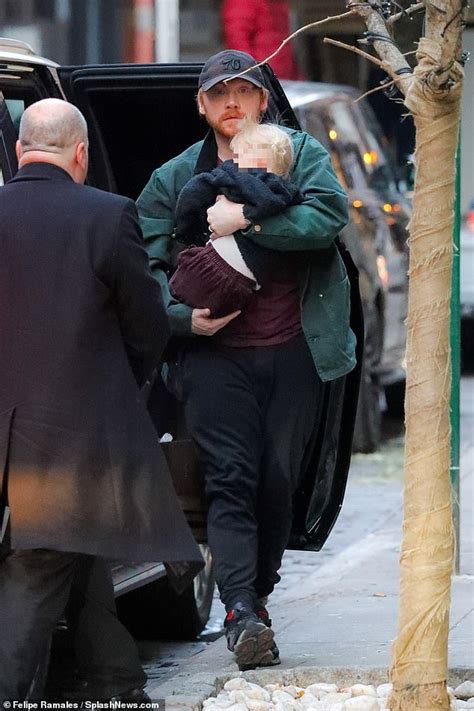 Rupert Grint carries his daughter Wednesday during a stroll in New York | Daily Mail Online