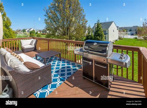 Backyard deck with patio furniture Stock Photo - Alamy