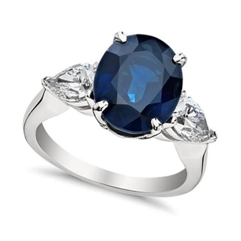 9.33 ct Oval Shape Sapphire With Pear Shape Diamond Anniversary Ring