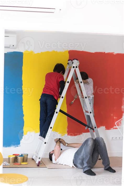 boys painting wall 10400937 Stock Photo at Vecteezy