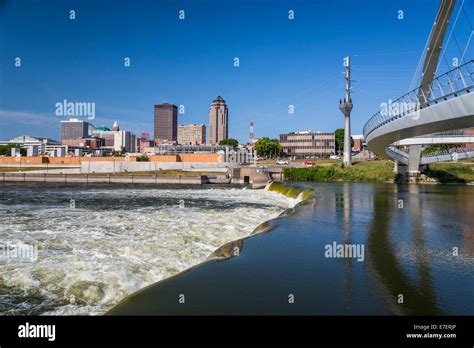 The Des Moines River Dam and downtown pedestrian bridge in Des Stock ...