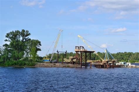 Premium Photo | Repair works are underway on the banks of the dnipro river