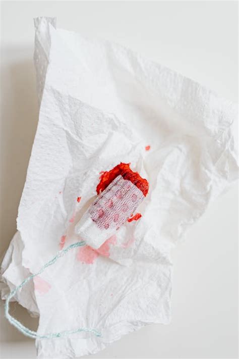 Close-Up Shot of a Tampon with Blood · Free Stock Photo