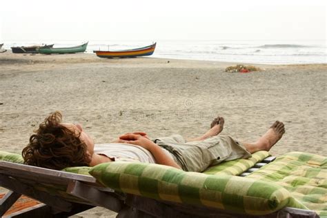 Man Laying Beach Stock Photos - Download 658 Royalty Free Photos