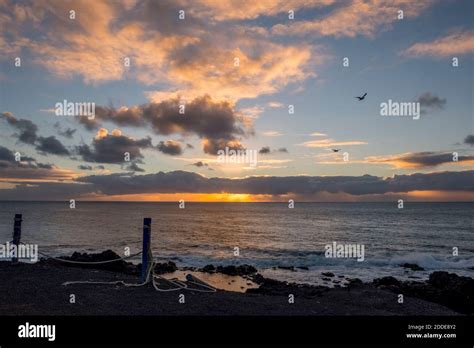 Sunset view at beach Stock Photo - Alamy