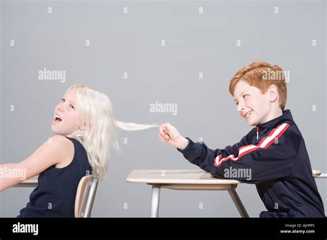 Boy pulling girl's hair Stock Photo: 4813556 - Alamy