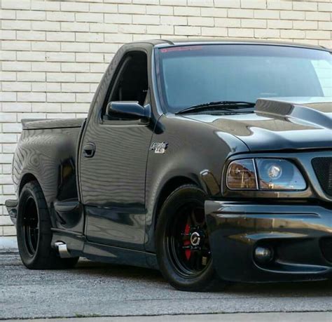 Fully built black ford f150 svt lightning with subtle exterior mods ...