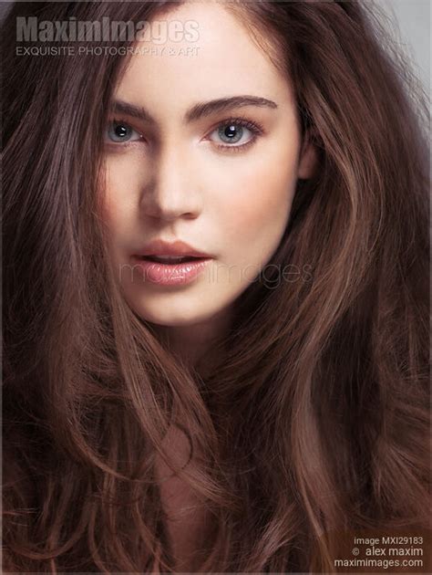 Photo of Beauty face portrait of a young woman with long brown hair and gray eyes | Stock Image ...