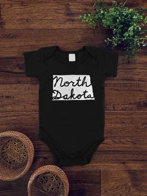 North Dakota Cursive Bodysuit Black w/ White Ink — Out of Town Clothing