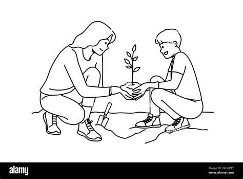 Caring young mother and son planting tree together. Smiling mom and child put seedling in ground ...