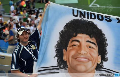 AFP News Agency on Twitter: "An Argentina fan holds a banner featuring ...