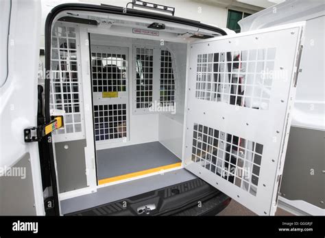 The back of a police van showing the cell where those arrested are detained Stock Photo - Alamy