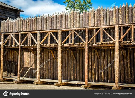 Medieval wooden fence made of palisade Stock Photo by ©Tagwaran 287501746