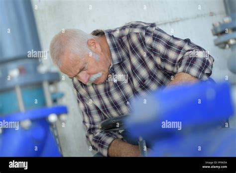 industrial worker in manufacturing plant Stock Photo - Alamy