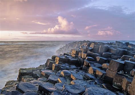 Sunset with the Giant`s Causeway in the Foreground Stock Image - Image ...