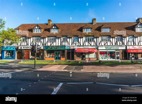 Parade of shops on Banstead village High Street, on a quiet Sunday morning in Surrey, England ...