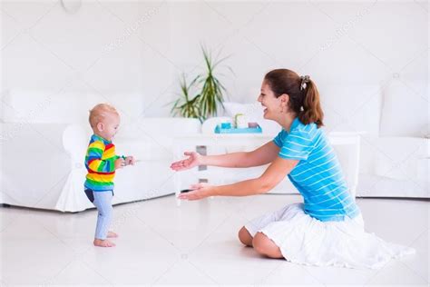 Baby making his first steps — Stock Photo © FamVeldman #58162889