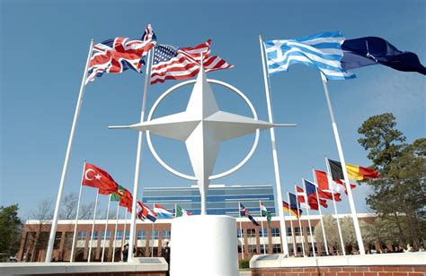 nato-symbol-with-flags-of-member-countries - Riigikogu