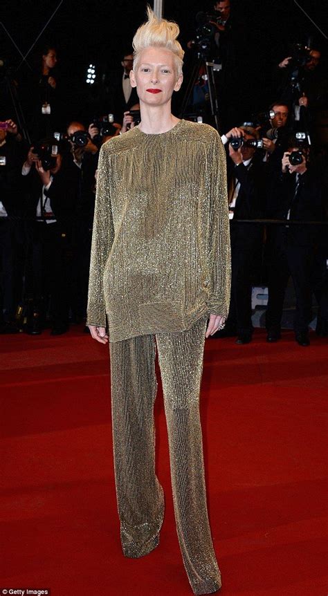 Tilda Swinton does glamorous: Oscar winning actress sparkles in loose trouser suit on Cannes red ...