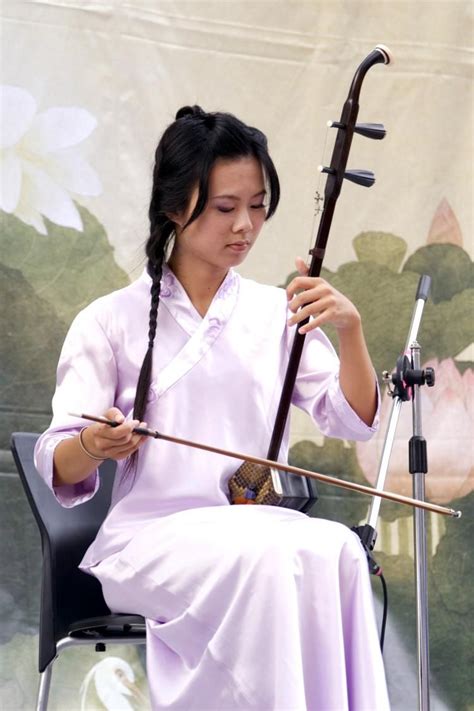 ERHU: Sound is produced by the bow's hair played on the strings. (Renjiun Wang/The Epoch Times ...