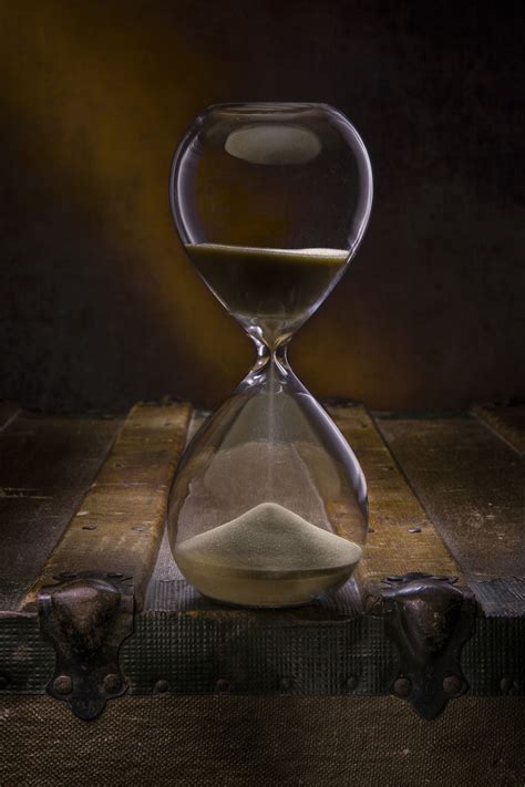 Hourglass on an old wooden trunk | Hourglass, Sand clock, Beautiful nature wallpaper