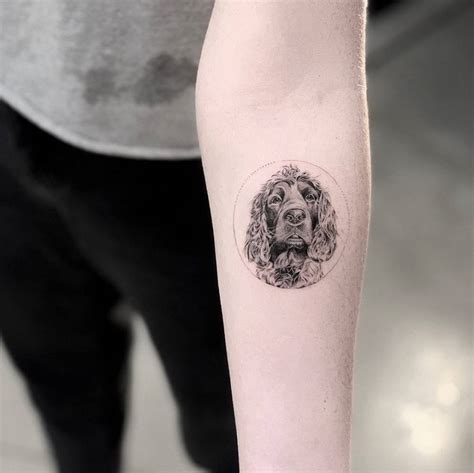 Cocker Spaniel tattoo on the inner forearm.