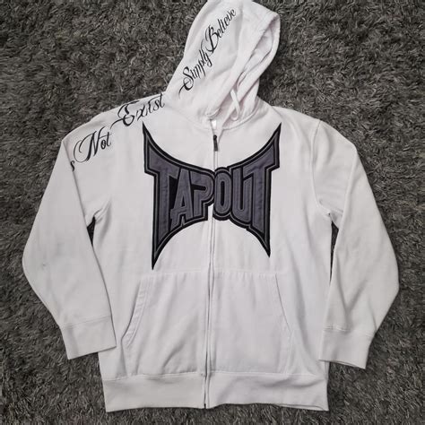 All white Tapout zip up hoodie this got the full... - Depop