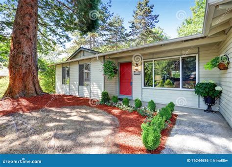 American Rambler House Exterior. View Of Walkway With Flower Bed. Stock ...