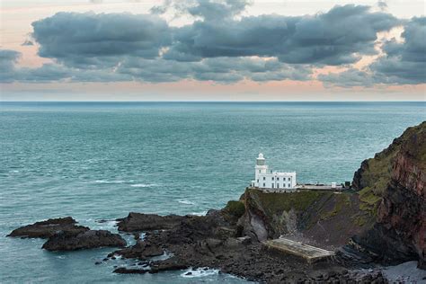 Lovely sunrise landscape image of Devon coastline in England wit ...