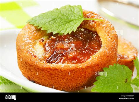 Small round cakes filled with apple puree Stock Photo - Alamy