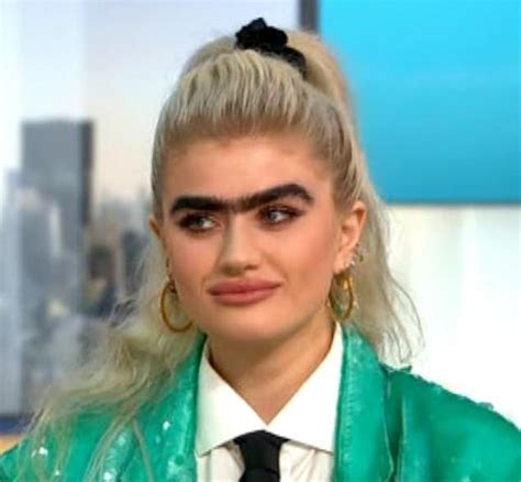 Model with jet-black monobrow admits she receives death threats online for her bushy facial hair ...