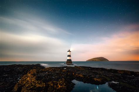 Lighthouse and landscape under the stars image - Free stock photo ...