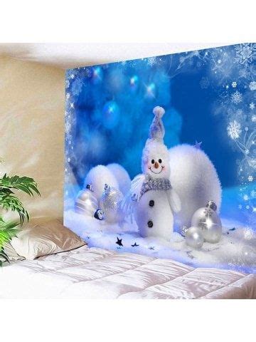 two snowmen are standing in front of a christmas scene wall hanging on the wall