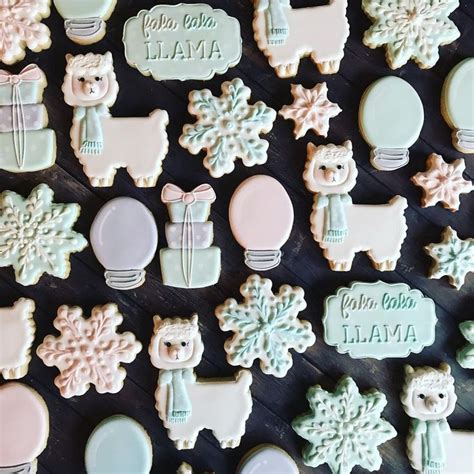 many decorated cookies are displayed on a table