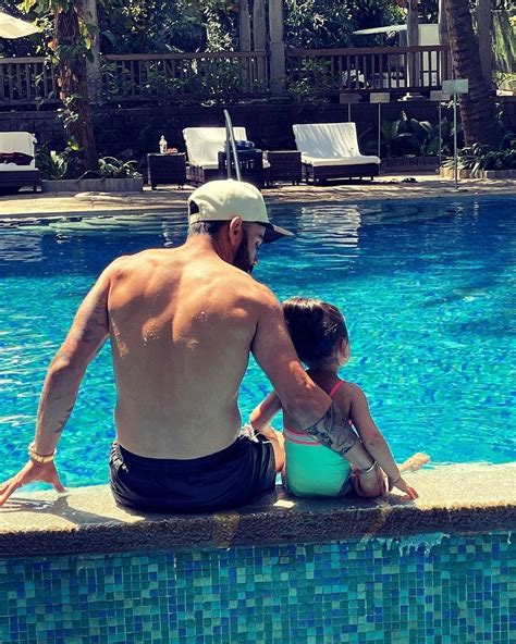 IPL: Precious! Kohli has quiet time with daughter Vamika - Rediff Cricket