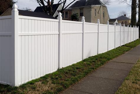 White fence in a residential neighborhood in 2021 | White vinyl fence, Vinyl fence, Fence paint