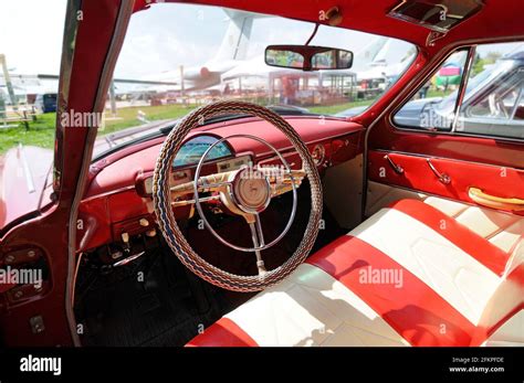 Interior of an old car GAZ Volga, made in USSR: steering wheel, dashboard, glove compartment ...