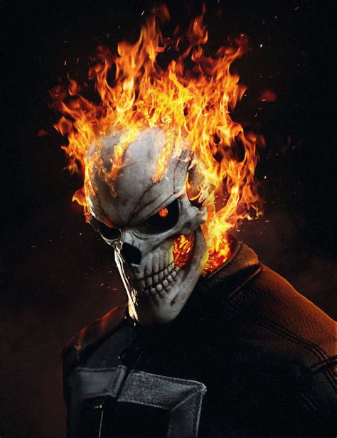 a skull with flames on it's face in the dark