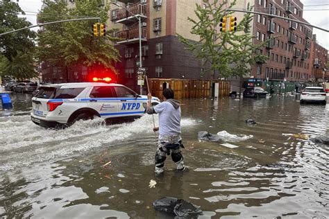 Heavy downpour in New York City shuts transit lines, floods basements ...