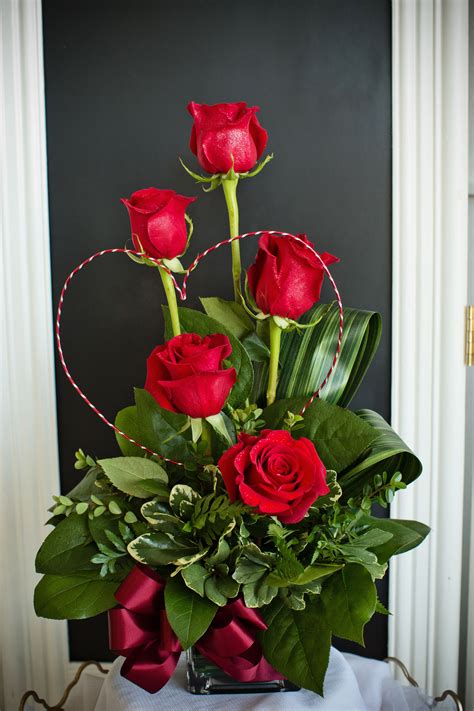 A stunning and unique Valentine's Day arrangement created with red rose ...