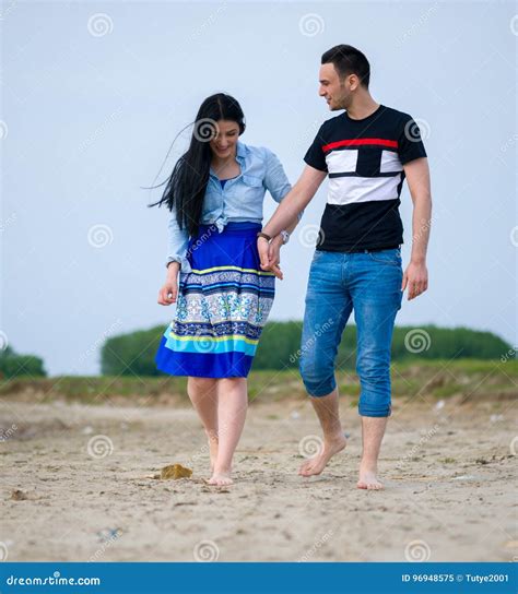 Two Lovers Holding Hands and Walking on the Beach Stock Image - Image ...