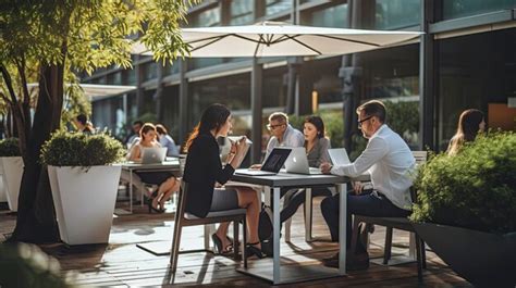 Premium AI Image | Business people working outdoors with laptop and tablet