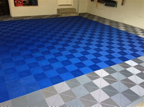 http://www.garageflooringllc.com/premium-rib-drain-tile-for-garages-and-more/ these tiles ...