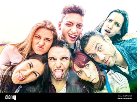 Multicultural millenial friends taking selfie with funny faces - Happy ...