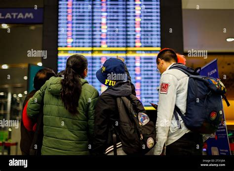 Bogota, Colombia - January 8, 2023: Passengers check their flight in front of the arrivals and ...