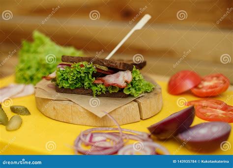 Grilled Dark Bread Sandwich on Wooden Plate on Yellow Board Stock Photo - Image of plate, slice ...